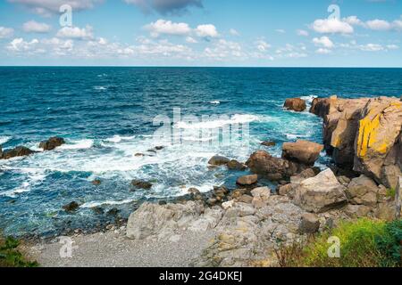 seascape of sozopol, bulgaria. wonderful scenery with cliffs in evening light. sunny weather with clouds above horizon. popular travel destination in Stock Photo