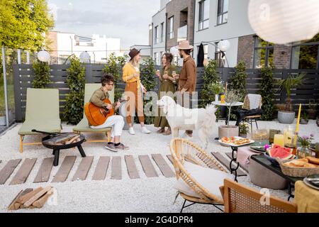 Friends having fun on a beautiful backyard Stock Photo
