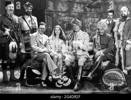 LUMSDEN HARE possibly MITCHELL LEWIS Director JOHN FORD MYRNA LOY VICTOR McLAGLEN ROY D'ARCY Assistant Director WINGATE SMITH and WALTER LONG on set candid group photo taken during filming of THE BLACK WATCH 1929 director JOHN FORD from novel King of the Khyber Rifles by Talbot Mundy Fox Film Corporation Stock Photo