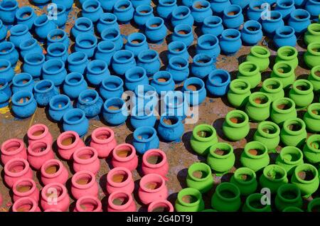 Pune, India - 30 Octo 2018, artist painting colors on terracotta pots, works of handicraft, for sale during Diwali Festival. Stock Photo