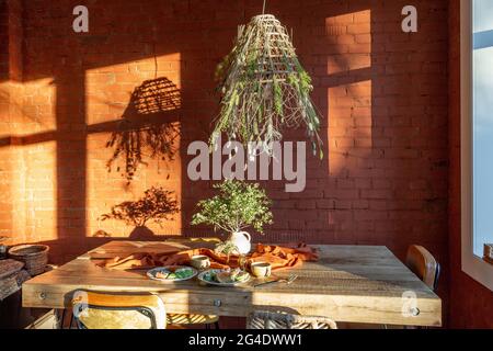 Dining place with a wooden table Stock Photo