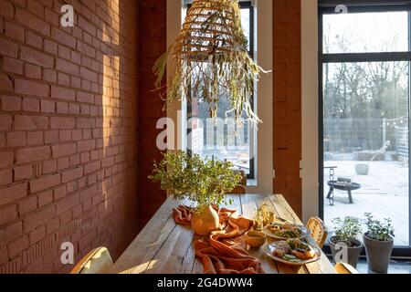 Dining place with a wooden table Stock Photo