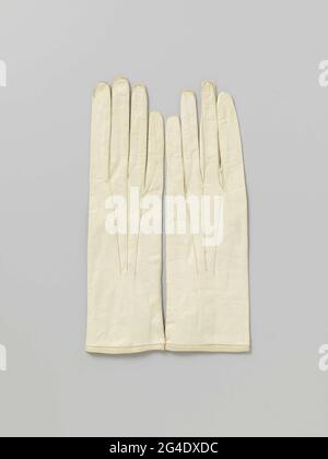 . Left formal glove from white glacerer. At the split a push button with yellow cans dust cap. On the hand three radiating cords. Couple connected to a thread. Stock Photo