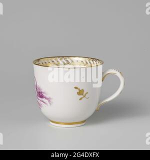 . Coffee cup, purple painted with winged putti floating on clouds. Along the edge a guilloches band with dependent flour glulands. Marked with a stork in blue under the glaze. N.B. German porcelain painted in The Hague. Stock Photo