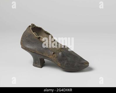 . Black leather shoe. Pretty wide forefoot, pointed nose. Drawwart heel that square is cut out. Only in the heel a seam. Pointed cut sheet, no belts or closure. Stock Photo