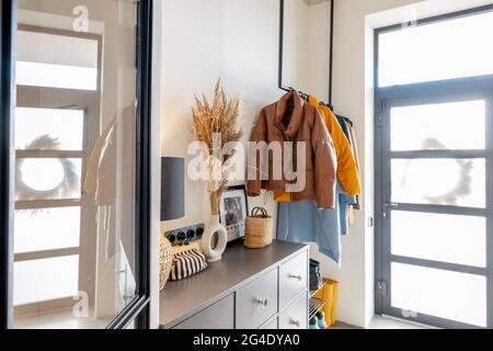 House hallway interior with clothes and furniture Stock Photo