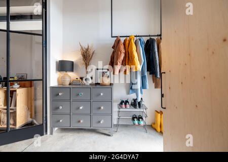 House hallway interior with clothes and furniture Stock Photo