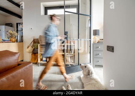 Stylish living room interior with a woman Stock Photo