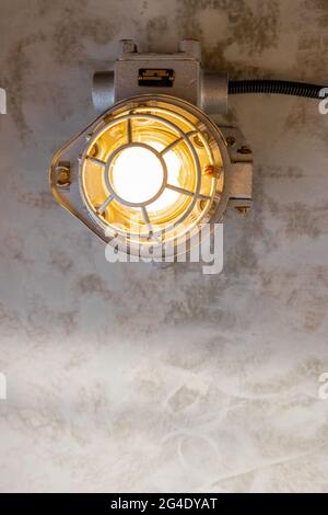 Industrial lamp on the concrete ceiling Stock Photo