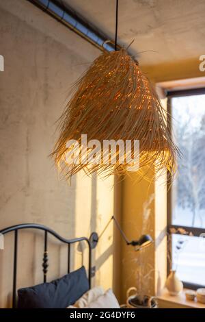 Stylish bedroom interior in natural boho style Stock Photo