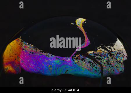 Beautiful psychedelic abstractions on the surface soap bubbles Stock Photo