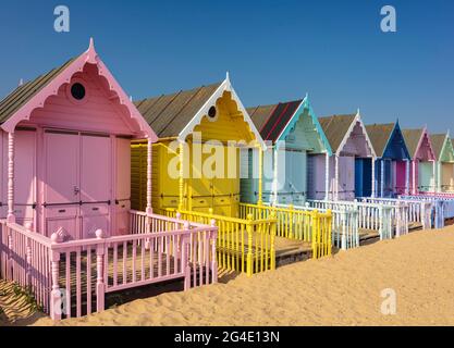 Pastel coloured beach huts, Mersea Island, Essex, UK.