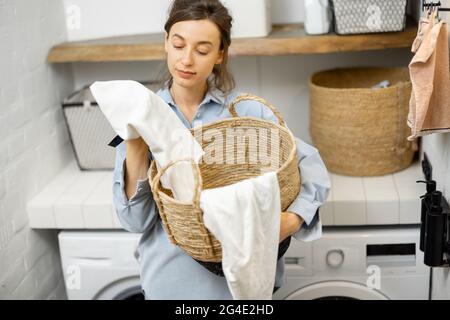 Portrait of a young housewife with clean clothes Stock Photo