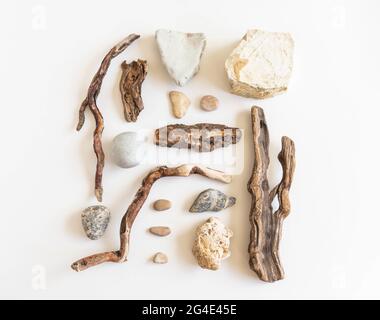 Flat lay composition from various driftwood and stones on a white background. Top view Stock Photo
