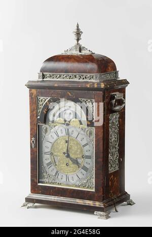 . This clock not only tells the time, it also gives the date and the phases of the sun and the moon. It has a movement with nine bells that can play ten melodies. In the early 18th century a timepiece with so many different functions was still a rare and precious object. Stock Photo
