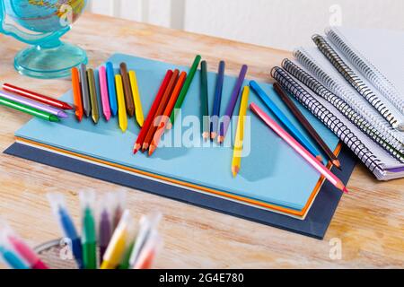 Colored pencils kept in pencil holder Stock Photo