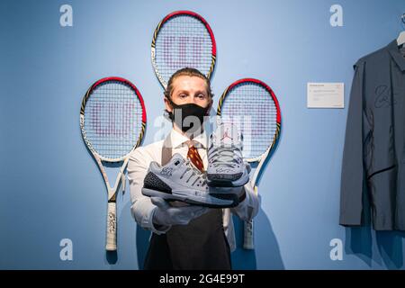 LONDON 21 June 2021. ROGER FEDERER S TOURNAMENT AIR JORDANS US OPEN 2014 Each signed Roger Federer with stitched Air Jordan Jumpman logo on the tongue made by Nike in iconic elephant print. Estimate 4...