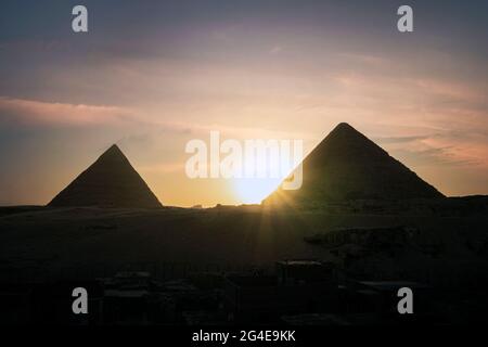 Archaeological complex of the Great Egyptian Pyramids is located on Giza plateau. Pyramids of Chephren Khafra and Cheops Khufu in the night light at s Stock Photo