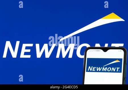 In this photo illustration, a Newmont Mining Corporation logo seen displayed on a smartphone. Stock Photo