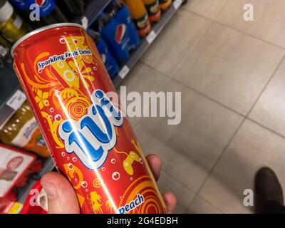 Picture of cans with the logo of Ivi orange for sale. Ivi is a brand of soft drink originally created in Greece and now owned by PepsiCo with global d Stock Photo