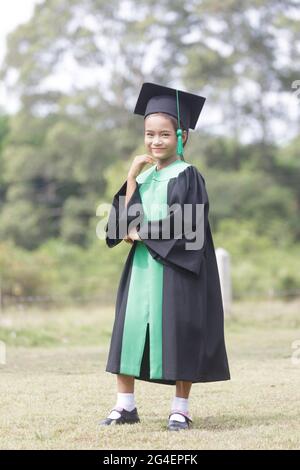 A portrait of an Asian female student graduating from kindergarten. Stock Photo