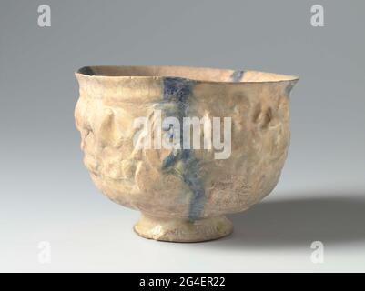 . Come from quartz frying goods, decorated in relief with yacht scenes and a seated person. On the outer wall, slightly continuous on the inner wall, three underglazing blue stripes under transparent alkalilation. Stock Photo