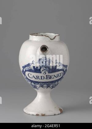 . Pharmacist spot from faience. With ear and spout and blue painted label with inscription: S / Card.Bened Stock Photo