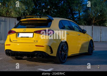 Mercedes-AMG A 35 in city parking at night Stock Photo