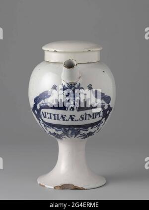 . Pharmacist spot from faience. With ear and spout and blue painted label with inscription: S / Althae AE. Simpl: Stock Photo