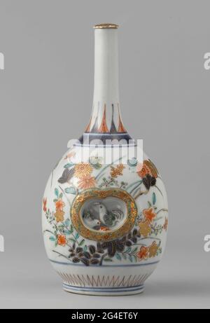 . Bottle of porcelain with a spherical body and a narrow neck, painted in underglaze blue and on the glaze red, green, black and gold. Two recessed boxes on the belly containing a flower branch or a chicken and a rooster. The courses are surrounded by a raised band with floral drinks. To flower branches. The shoulder with a bond with curlwork with standing, pointed leaf motifs on it. A decorative band around the foot. A crack in the bottom. Imari. Stock Photo
