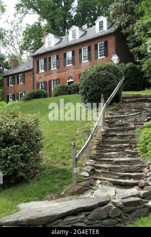 Virginia, USA. Large house on a hill, with stone steps leading to it.