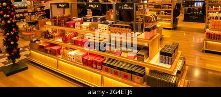 Paris, France - september 18, 2020 . Maxim's products on sale in duty free shop at Paris airport, France. Famous brand of food, french landmark Stock Photo