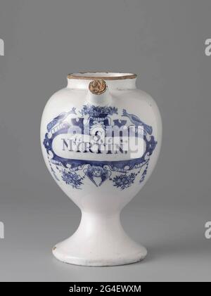 . Pharmacist spot from faience. With ear and spout and blue painted label with inscription: S, / mytrin. Stock Photo