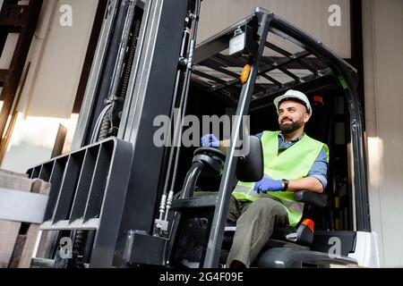 Work in warehouse, loading organic fruits for sale and production of juices Stock Photo