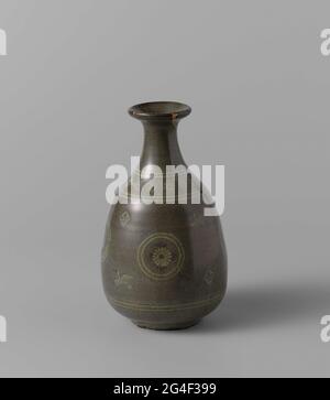 . Bottle-shaped vase of stoneware, with white inserted with a celadon glaze. The vase has an egg-shaped body and a narrow, escaped neck. On the belly four times a stylized flower in a medallion with a bird and a leaf each time in between. On the shoulder a band with stylized flowers. The vase has a few cracks that have been restored with gold lacquer. Korean Karatsu. Stock Photo