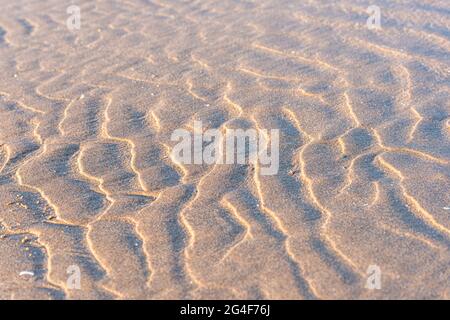 Wave patterns in sand on woolacombe beach Stock Photo