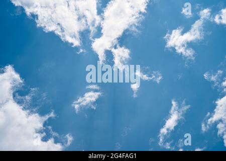 White clouds in the blue sky on a sunny day. Close-up Stock Photo