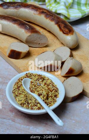 Bowl of Dijon mustard and sausages, Germany Stock Photo