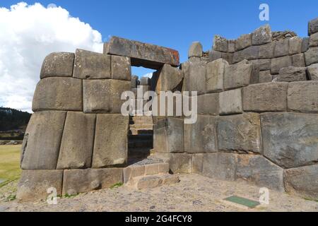 Stone gate in the fortress wall of the Inca ruins Sacsayhuaman, Cusco, Peru Stock Photo