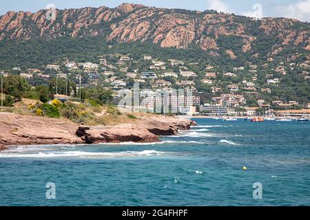 The coastline of the 'Corniche d'Or' near Saint Raphael, France, showing the red rock formations of the 'Massif de l'Esterel'. Stock Photo