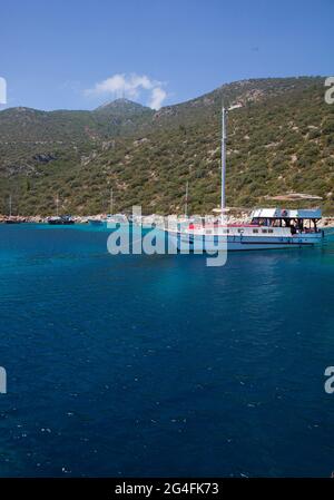 Charter boats moored in a secluded part of the bay of Kalkan in Turkey.  Kalkan is a popular holiday destination and is located on the Turkish Mediter Stock Photo