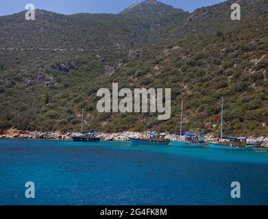 Charter boats moored in a secluded part in the bay  of Kalkan , Turkey.  Kalkan is a popular holiday destination and is located on the Turkish Mediter Stock Photo