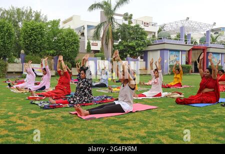 A group of Indian women perform yoga on International Yoga Day in Beawar. Yoga day has been celebrated annually on June 21 since 2015. Yoga is a physical, mental and spiritual practice which originated in India. (Photo by Sumit Saraswat/Pacific Press) Stock Photo