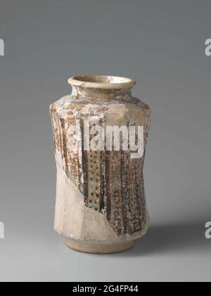 . Apotheker spot from quartz frying goods decorated with scripture and tendrils in red-brown luster and blue in vertical tires on white background of glaze. Stock Photo
