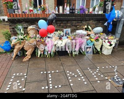 London, UK, 21 June 2021: Tributes line a wall on Bedford Hill in Balham where Mattias Poleon, 27, was shot dead outside his home on 17 June 2021. Tributes included flowers, candles, framed photos, bottles of alcohol and Father's Day balloons. Anna Watson/Alamy Live News. Stock Photo