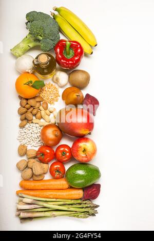 fresh fruits and vegetables on the white background with space for text Stock Photo