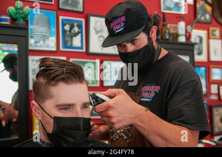 Inside an American style barbershop in the UK Stock Photo