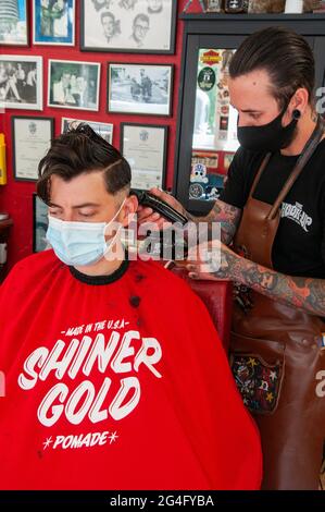 Inside an American style barbershop in the UK Stock Photo