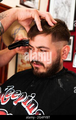 Inside an American style barbershop in the UK Stock Photo