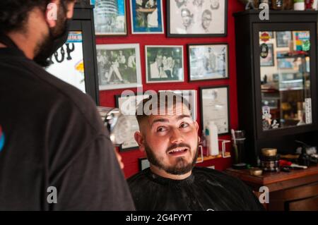 Inside an American style barbershop in the UK Stock Photo